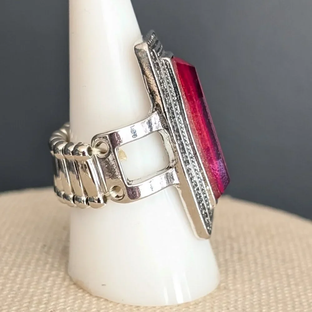 Orangey red glass ring with center bright blue stripe stretch ring